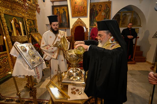 Oils from the Mount of Olives being mixed with essential oils and blessed in Jerusalem by the Patriarch of Jerusalem, His Beatitude Patriarch Theophilos III, to become Chrism Oil, which will be used in the coronation of King Charles (Patriarchate of Jerusalem/Buckingham Palace/PA)