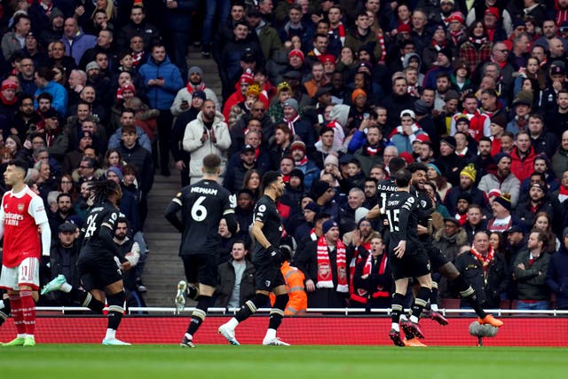 Philip Billing, right, and Bournemouth celebrate after taking the lead barely nine seconds into their game at Arsenal (John Walton/PA)