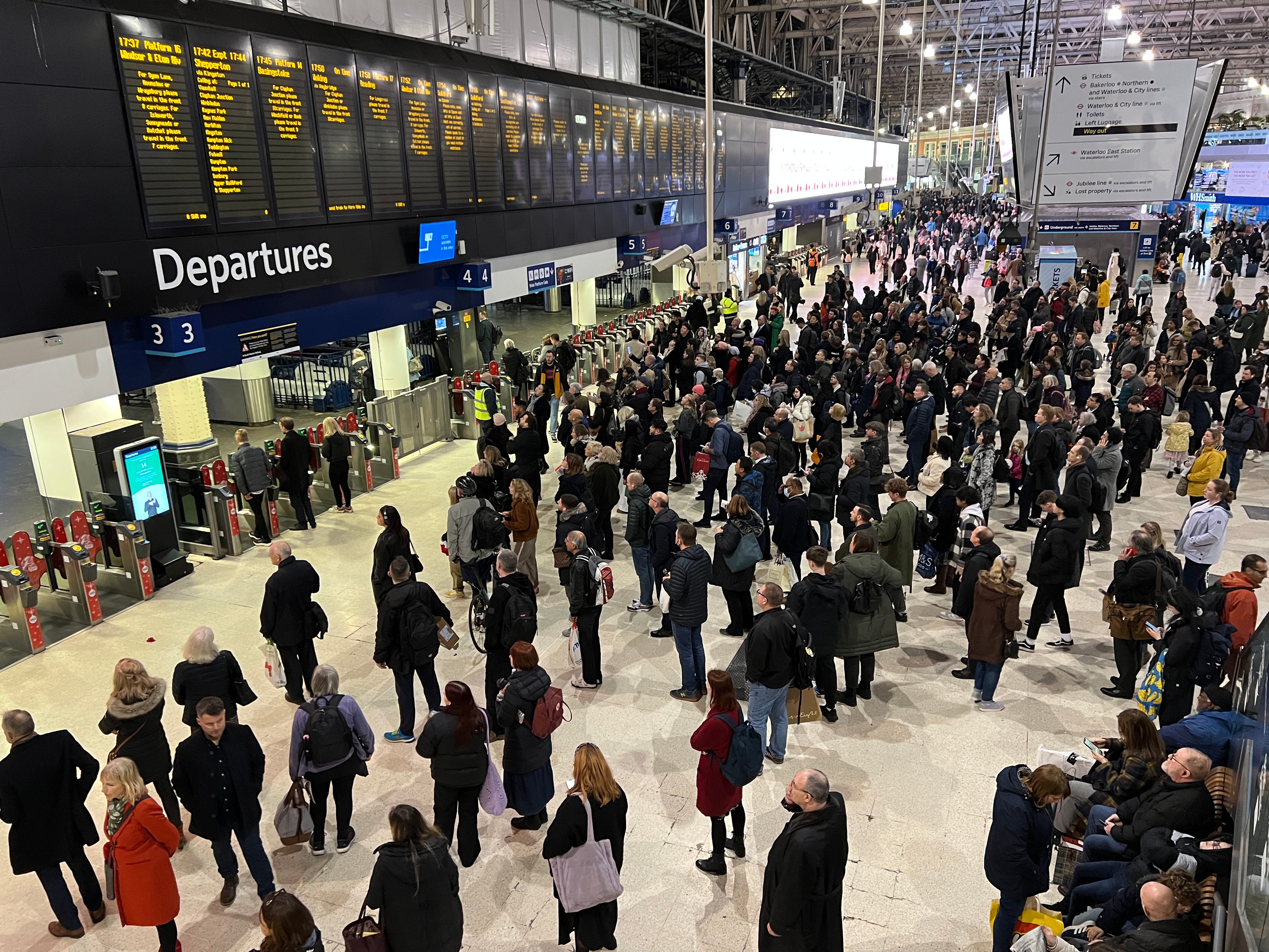 Waiting game: Commuters at London Waterloo, the busiest rail station in the UK