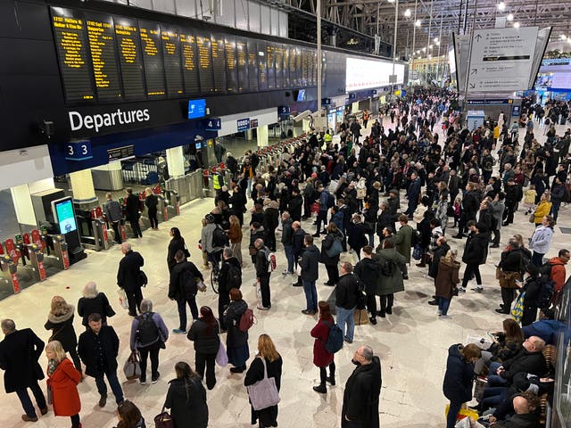 <p>Waiting game: Commuters at London Waterloo, the busiest rail station in the UK</p>