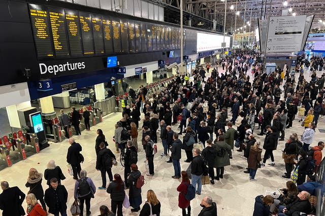 <p>Waiting game: Commuters at London Waterloo, the busiest rail station in the UK</p>
