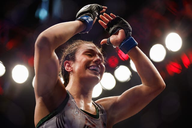 <p>Alexa Grasso celebrates winning the women’s flyweight title</p>