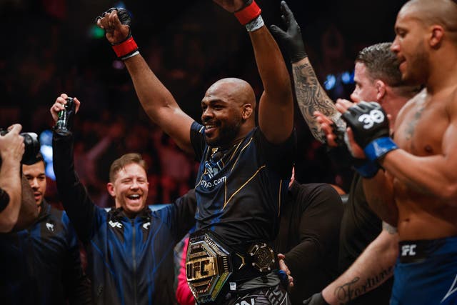 <p>Jon Jones celebrates winning the UFC heavyweight title</p>