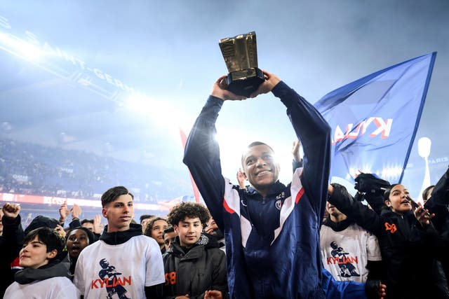 Kylian Mbappe celebrates after becoming Paris St Germain’s all-time top scorer (Franck Fife/AP)