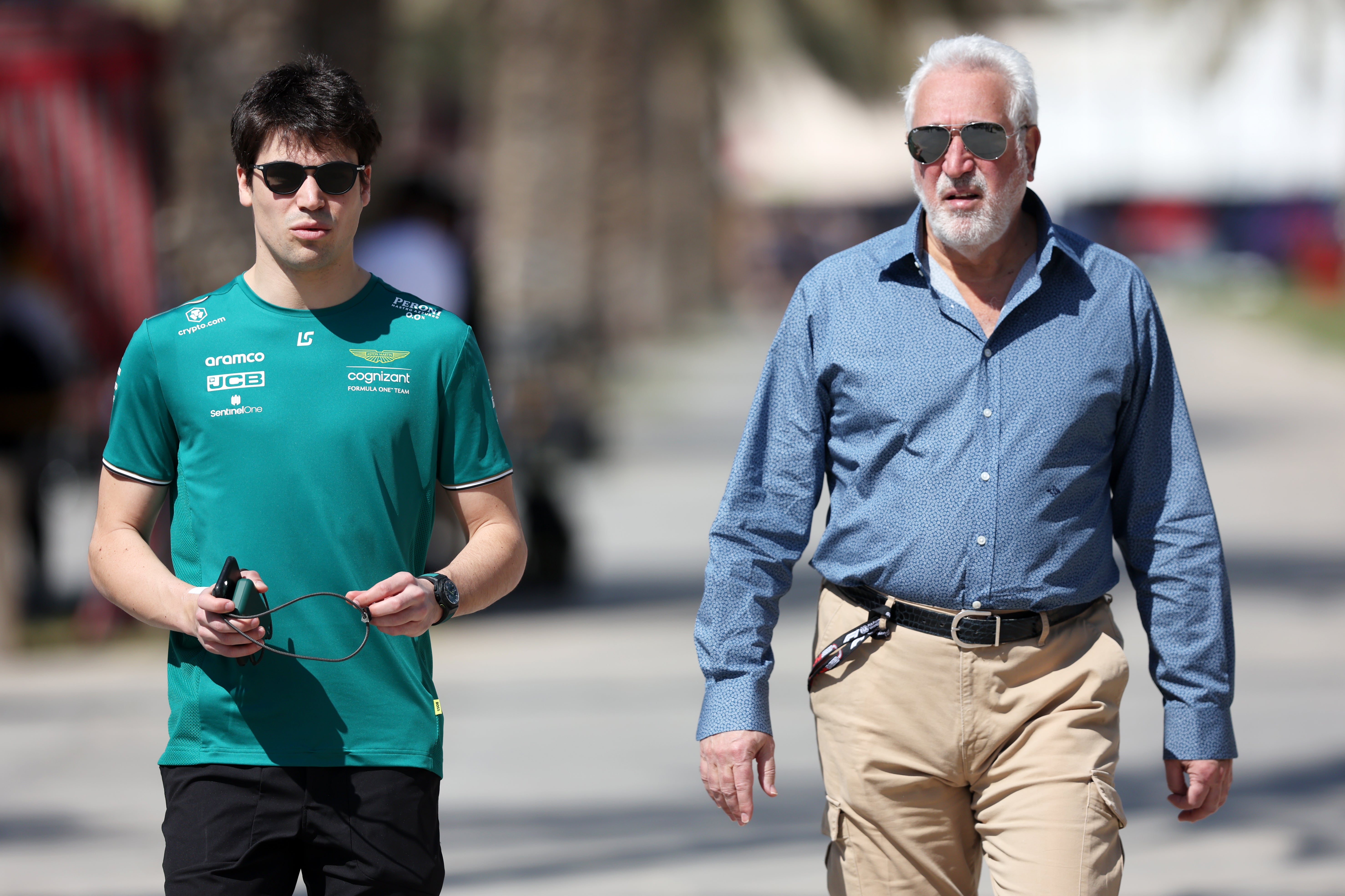 Lawrence Stroll (right) is the team owner and his son Lance (left) drives for the team