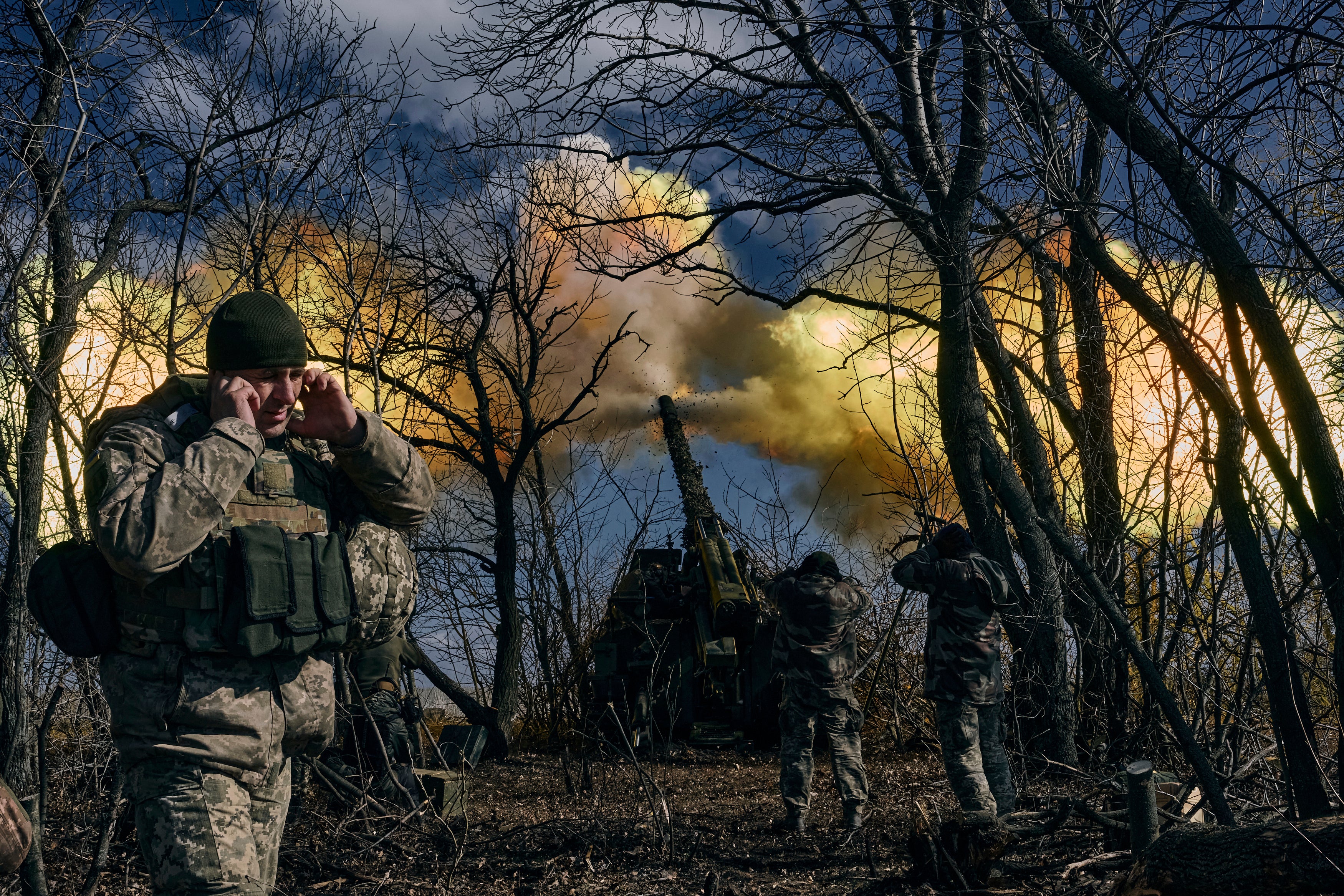 Ukrainian soldiers fire a self-propelled howitzer towards Russian positions near Bakhmut on Sunday