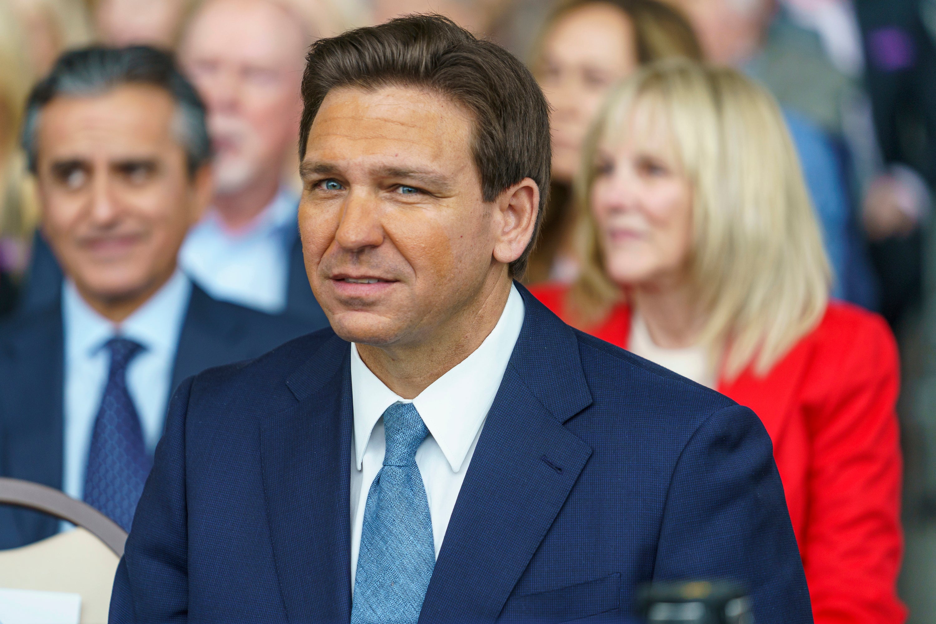 Florida Republican Gov. Ron DeSantis sits with his family before addressing supporters at The Ronald Reagan Presidential Library in Simi Valley, Calif., Sunday, March 5, 2023. DeSantis has quietly begun to expand his political coalition on his terms just as he releases a book, "The Courage to be Free," which comes out Tuesday. (AP Photo/Damian Dovarganes)