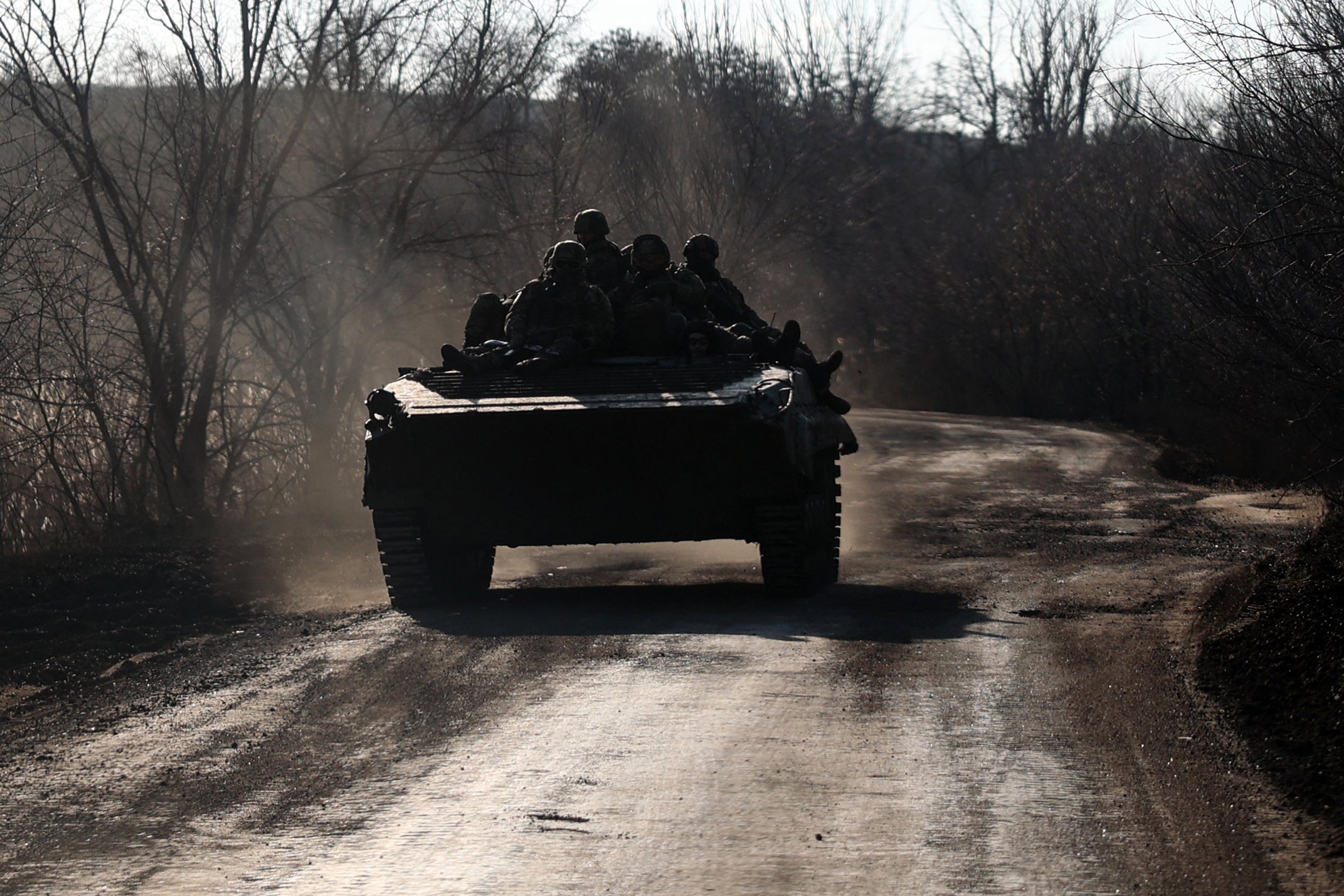 Ukrainian soldiers ride an infantry fighting vehicle along a road not far from Bakhmut, Donetsk region, on Sunday amid the Russian invasion of Ukraine