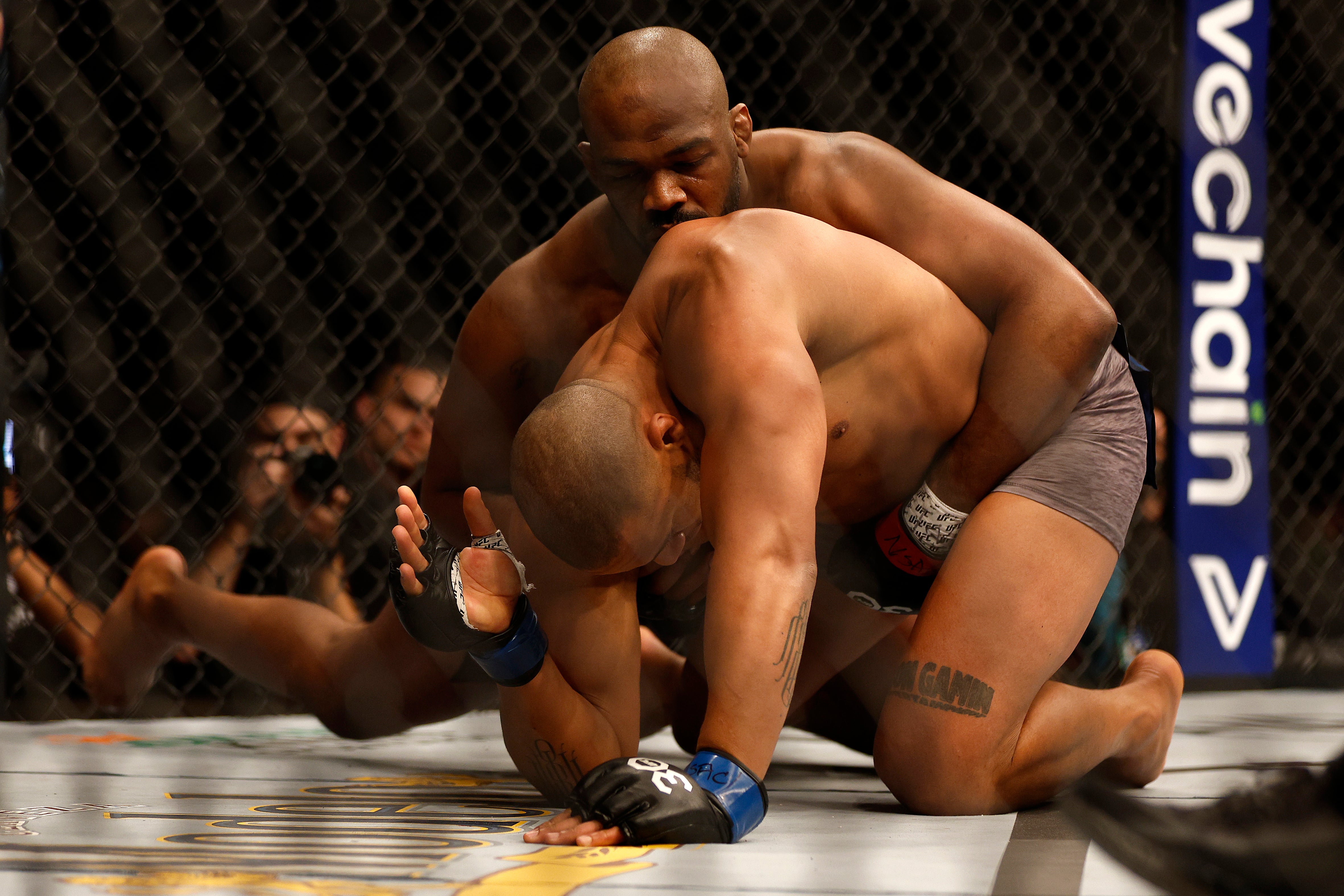 Jones (top) submitted Ciryl Gane in Round 1 in March to win the UFC heavyweight title