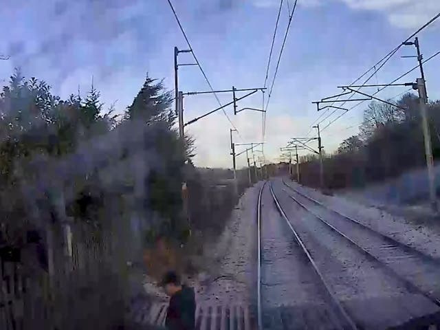 <p>A man wearing a cap can be seen rushing across from one side of the line to the other, speeding up as he approaches the other side</p>