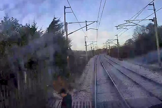 <p>A man wearing a cap can be seen rushing across from one side of the line to the other, speeding up as he approaches the other side</p>