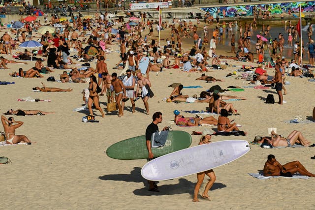 <p>Crowds of people enjoy the beach as parts of Australia’s east reached their hottest day in more than two years </p>
