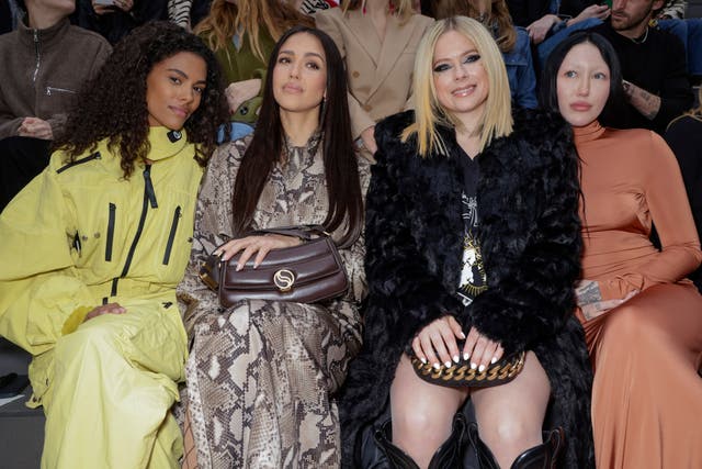 Jessica Alba and Avril Lavigne were along famous faces at the Stella McCartney show (Vianney Le Caer/Invision/AP)