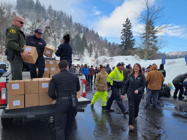 <p>The San Bernadino County Sheriff’s Department distributes supplies</p>