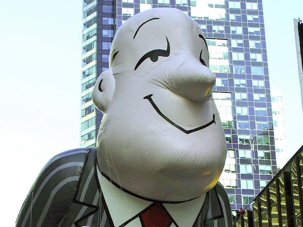 The Ask.com Jeeves balloon moves through Times Square in New York 23 November, 2000, during the 74th Macy’s Thanksgiving Day Parade