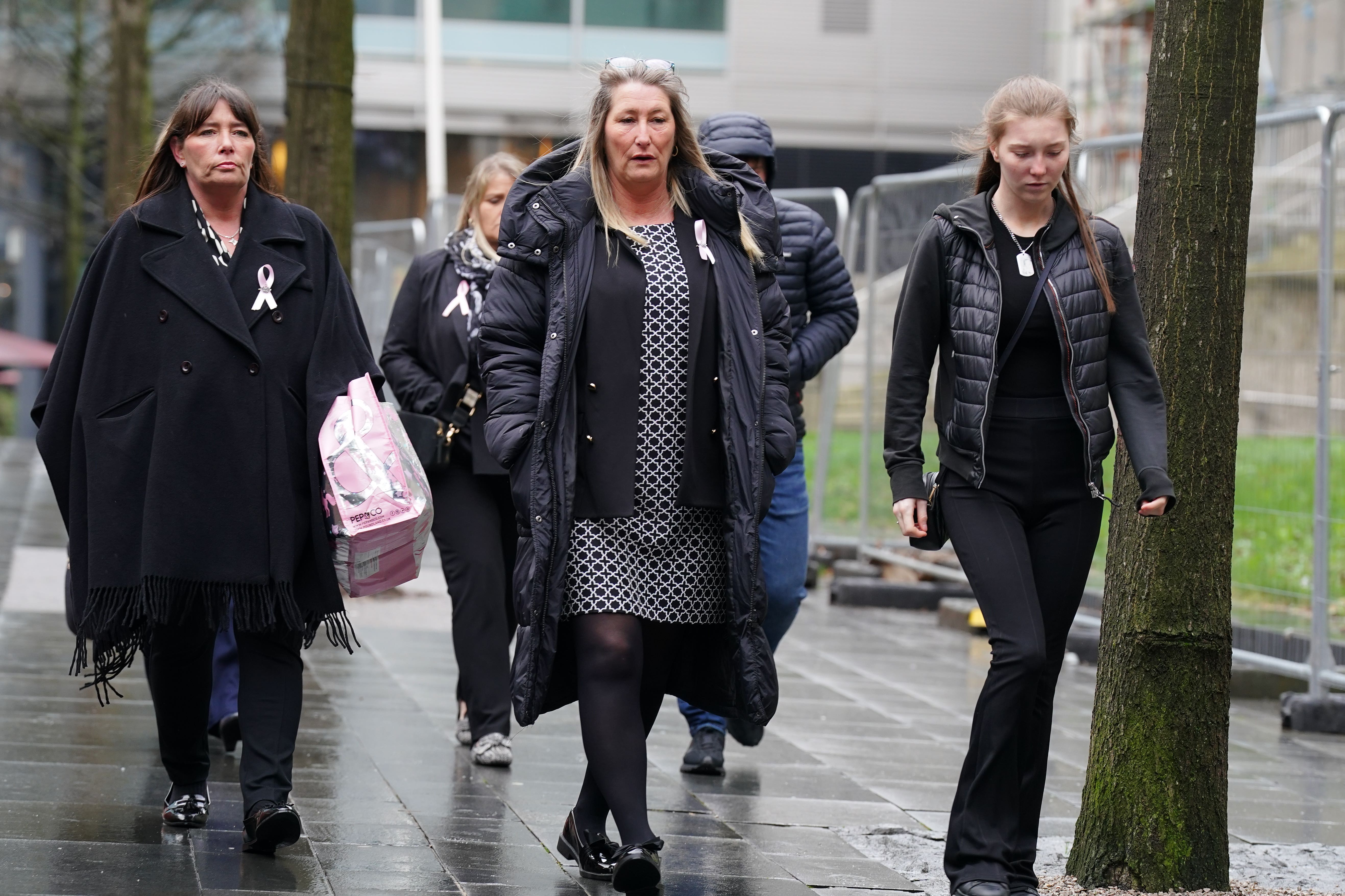 Cheryl Korbel, centre, mother of nine-year-old Olivia Pratt-Korbel, arrives with family members at Manchester Crown Court for the trial of Thomas Cashman, who is charged with murdering her daughter, who was shot in her home in Dovecot, Liverpool, on August 22 (Peter Byrne/PA)