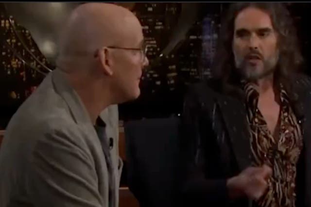 <p>Russell Brand, right, accuses political analyst John Heilemann of hypocrisy, claiming MSNBC and Fox News express the same level of bias in their reporting, during an episode of Real Time with Bill Maher</p>