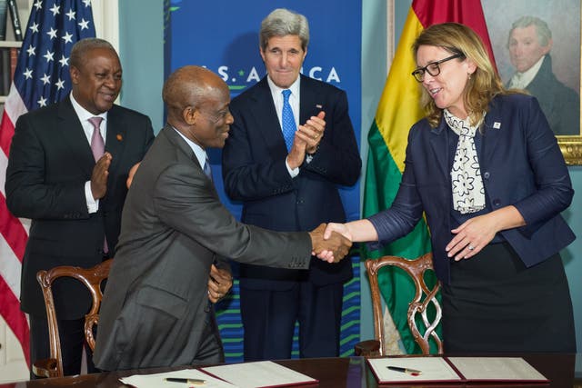 <p>Ghana President John Dramani Mahama(Rear L),  and US Secretary of State John Kerry(Rear R) applaud as Ghana Finance Minister Seth Terkper(Front L) and Dana Hyde, CEO of the Millennium Challenge Corporation (MCC), shake hands after signing the Ghana Compact during ceremonies at the State Department  August 6, 2014 in Washington, DC</p>