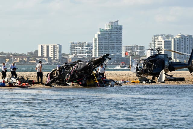 <p>Two sightseeing helicopters crashed on the Gold Coast(Dave Hunt/AAP Image/AP)</p>