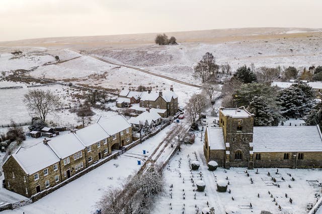 <p>St Mary's Church in Goathland, North Yorkshire, is surrounded by snow as weather warnings for snow and ice are in place across all four nations of the UK and more are expected to be issued as Arctic air sweeps across the country</p>