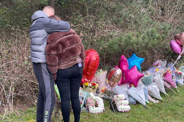 Floral tributes left near the scene in the St Mellons area of Cardiff (Bronwen Weatherby/PA)