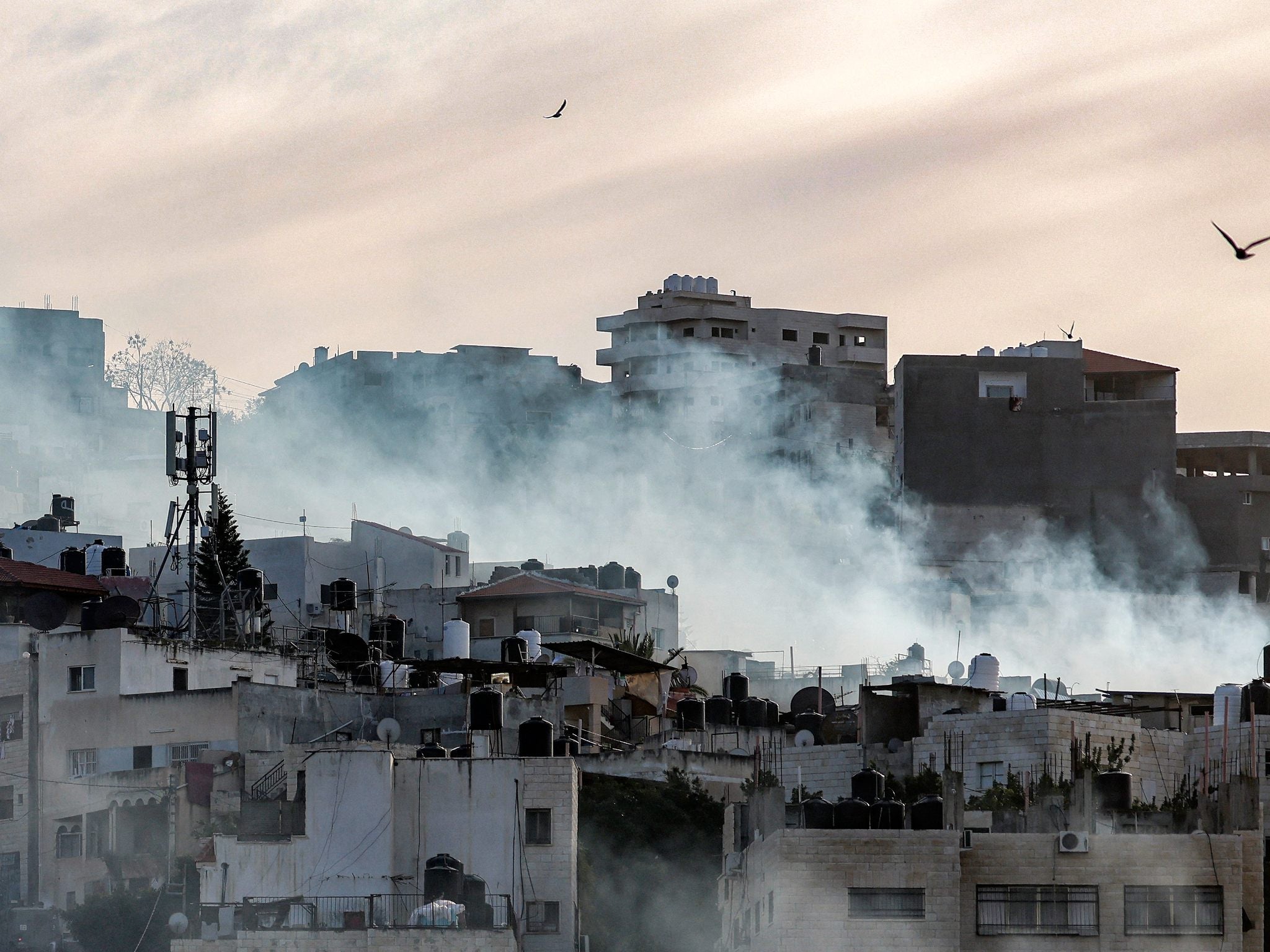 <p>Smoke plumes billow during the Israeli army raid in the Jenin camp</p>