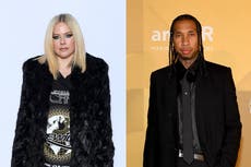 Avril Lavigne and Tyga seemingly confirm relationship with kiss during Paris Fashion Week