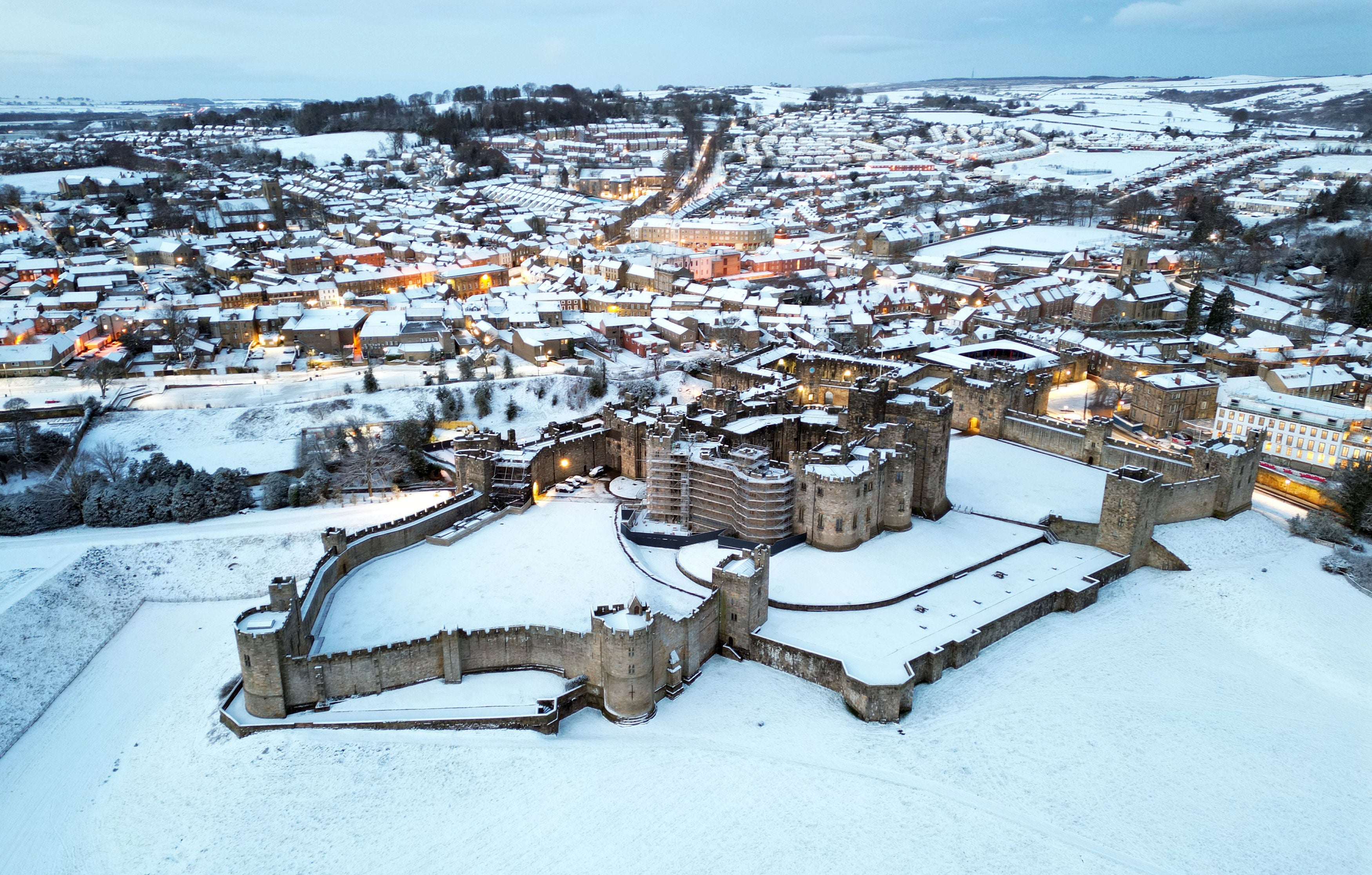 Snow covered fields surround Alnwick Castle in Northumberland as weather warnings are in place across all four nations