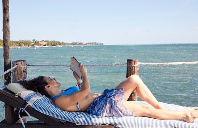 <p>Many people said are more confident about their book choices when on holiday, reading subject matter they’d be too embarrassed to when at home</p>