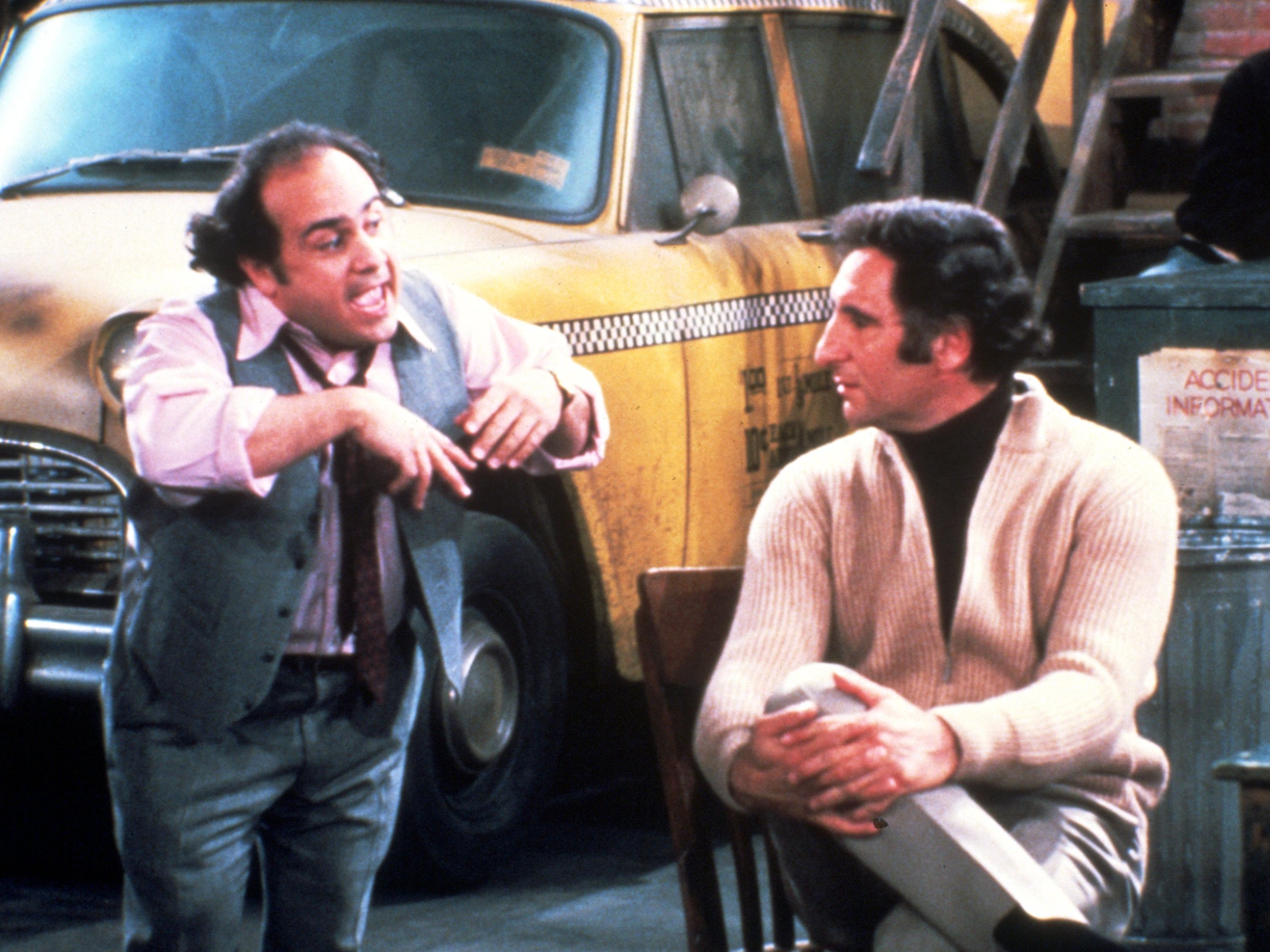 Danny DeVito as the contemptable Louie De Palma and Hirsch as Alex Rieger in ‘Taxi'