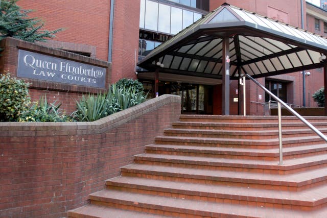 The trial is taking place at Birmingham Crown Court (PA)