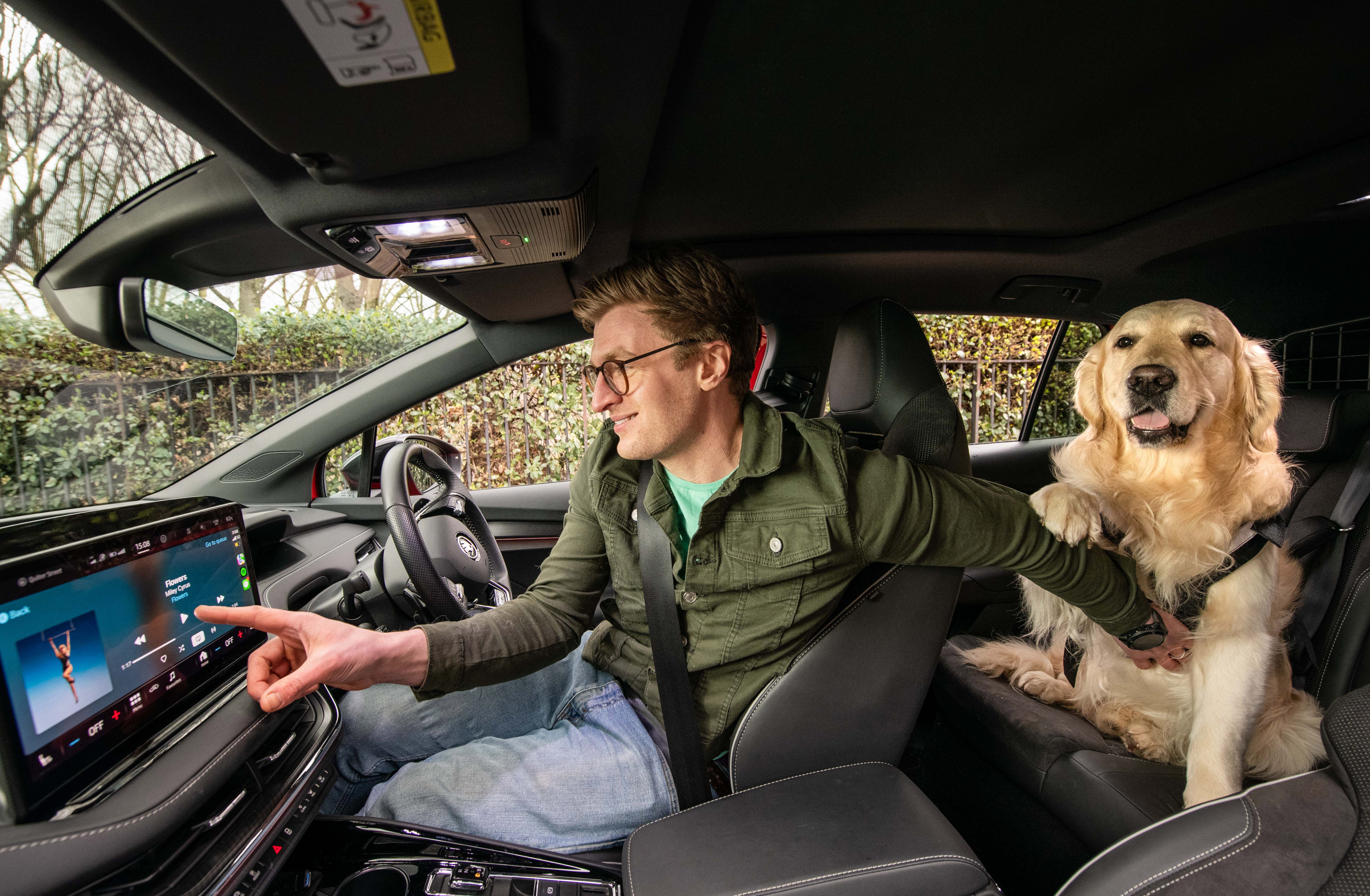 Dog owner Aaron Green with Labrador Boris enjoying the Spotify playlist.