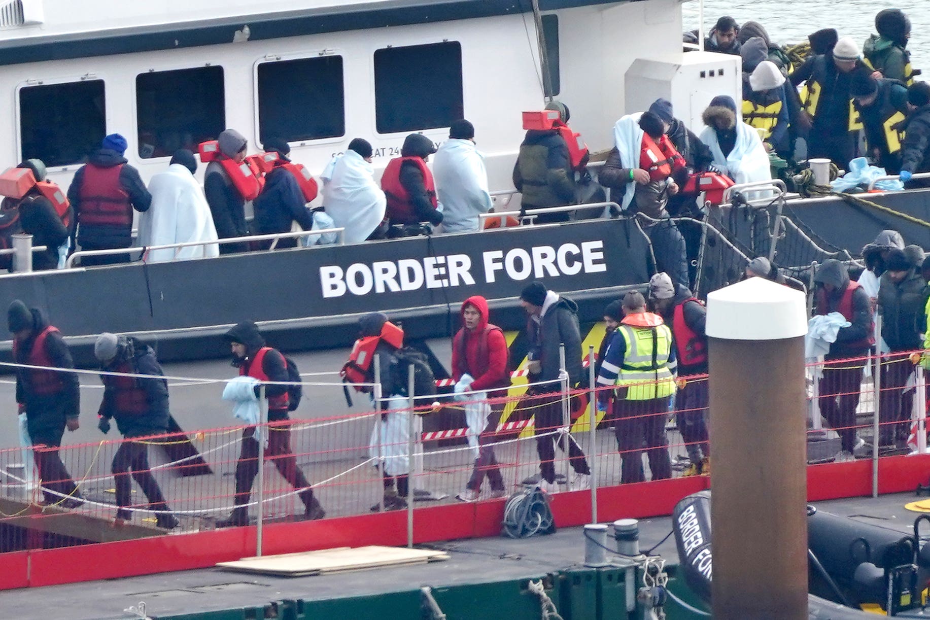 Migrants being brought in to Dover, Kent, onboard a Border Force vessel