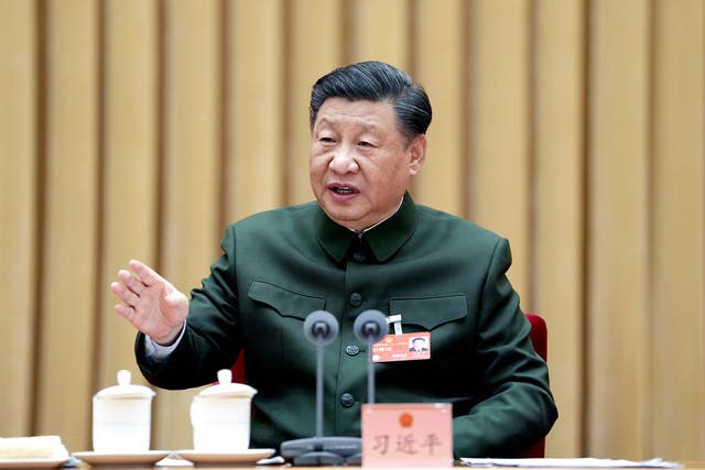 <p>In this photo released by Xinhua News Agency, Chinese president Xi Jinping attends a plenary meeting of the delegation of the People's Liberation Army (PLA) and the People's Armed Police Force during the first session of the 14th National People's Congress (NPC) in Beijing, on Wednesday, 8 March 2023</p>