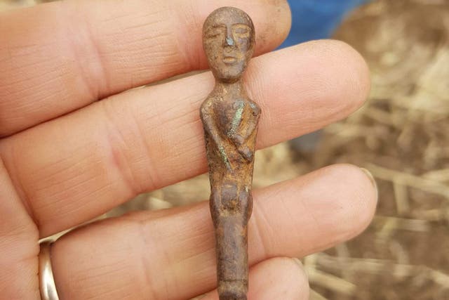 A bronze Celtic artefact of a nude figure with a hinged phallus in its right hand fetched ?2,200 at Noonans Ancient Coins and Antiquities sale (Paul Shepheard/PA)