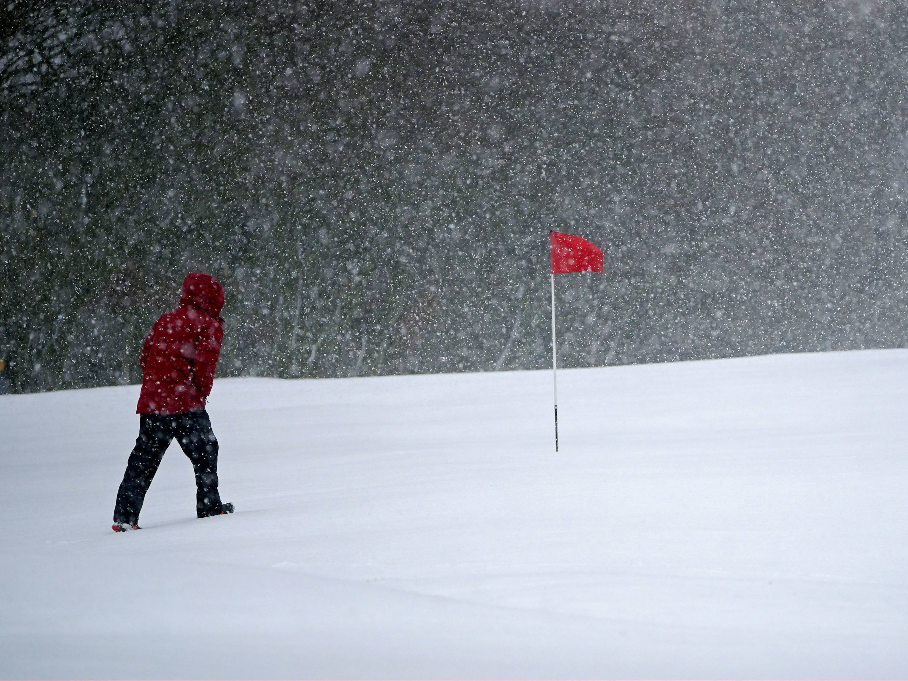 Snow falls at the Saddleworth Moor golf course in Uppermill near Oldham