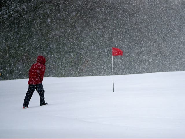 <p>Snow falls at the Saddleworth Moor golf course in Uppermill near Oldham</p>