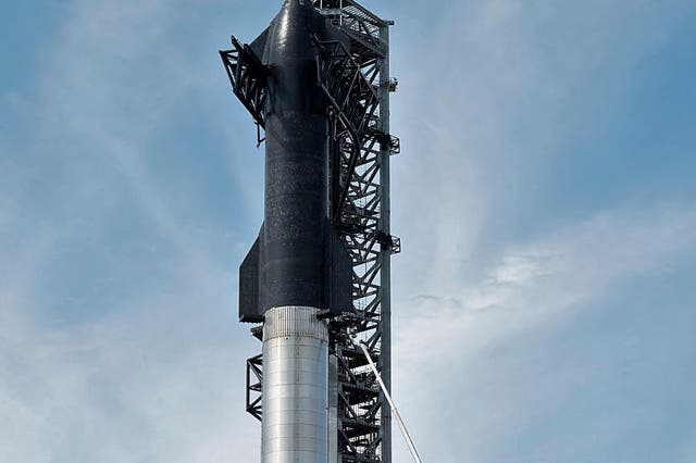 <p>SpaceX’s first orbital Starship stacked atop its massive Super Heavy Booster at the company’s Starbase facility near Boca Chica Village in South Texas on 10 February, 2022</p>