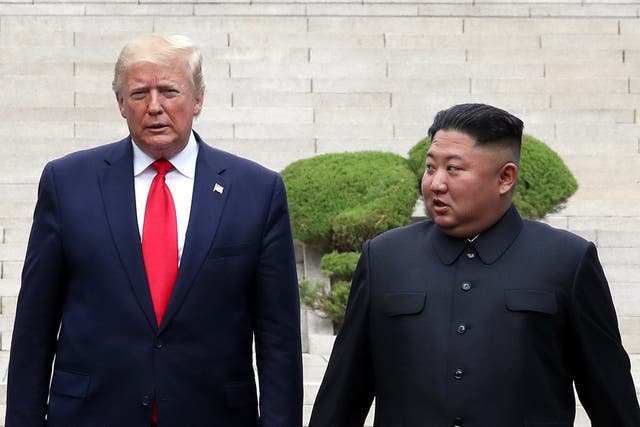 <p>A handout photo provided by Dong-A Ilbo of North Korean leader Kim Jong Un and U.S. President Donald Trump inside the demilitarized zone (DMZ) separating the South and North Korea on June 30, 2019</p>