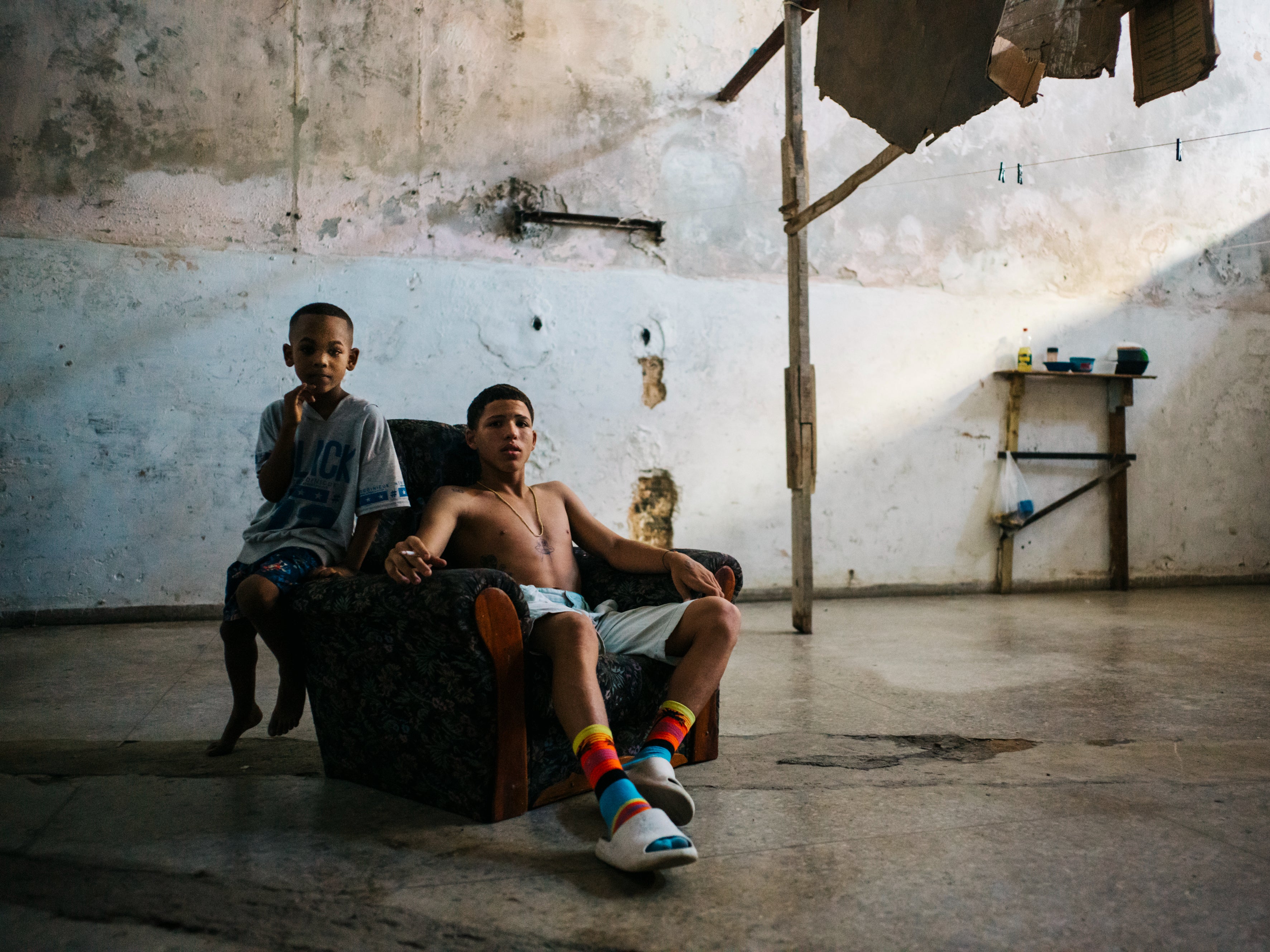 Two boys in an abandoned building in neighbourhood Centro Habana of Havana, Cuba