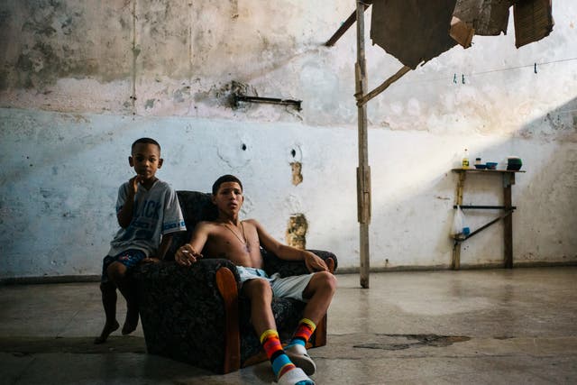 <p>Two boys in an abandoned building in neighbourhood Centro Habana of Havana, Cuba</p>