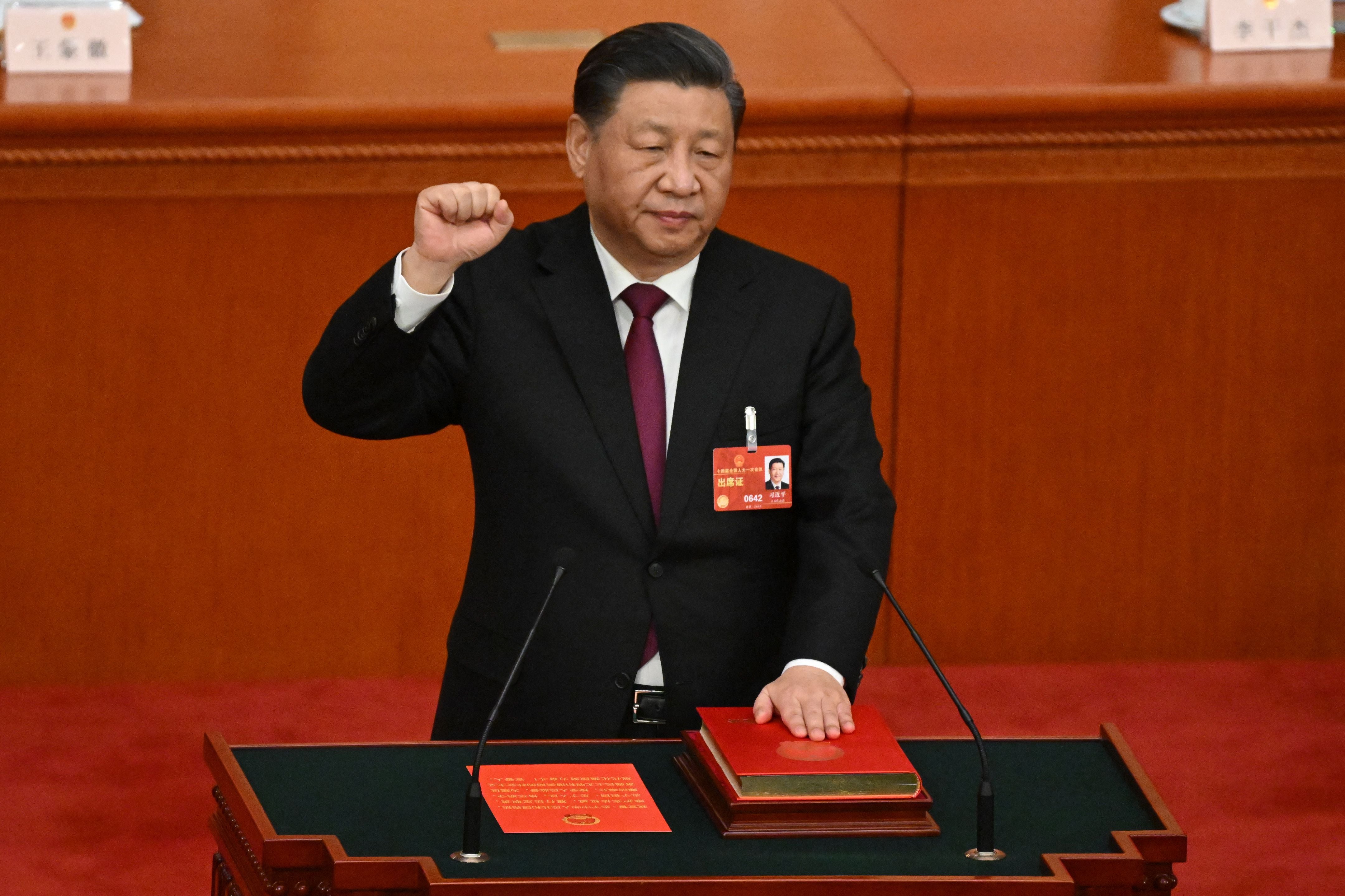 China's President Xi Jinping swears under oath after being re-elected