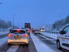 UK weather – latest: Snow causes chaos on roads as Storm Larisa sees drivers stuck overnight