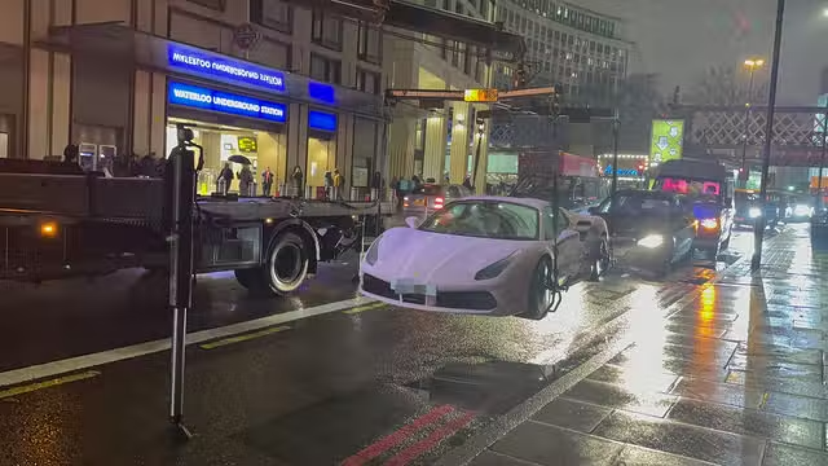 Pink Ferrari worth &pound;175,000 towed after &lsquo;parking in bus lane&rsquo;