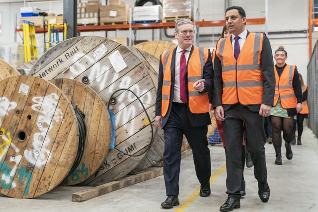 Labour leader Keir Starmer and Scottish leader Anas Sarwar during a visit to Siemens Rail Automation Cambuslang Depot in Glasgow (Jane Barlow/PA)