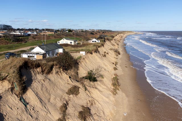 Homes sit close to the cliff edge at Hemsby in Norfolk (Joe Giddens/ PA)