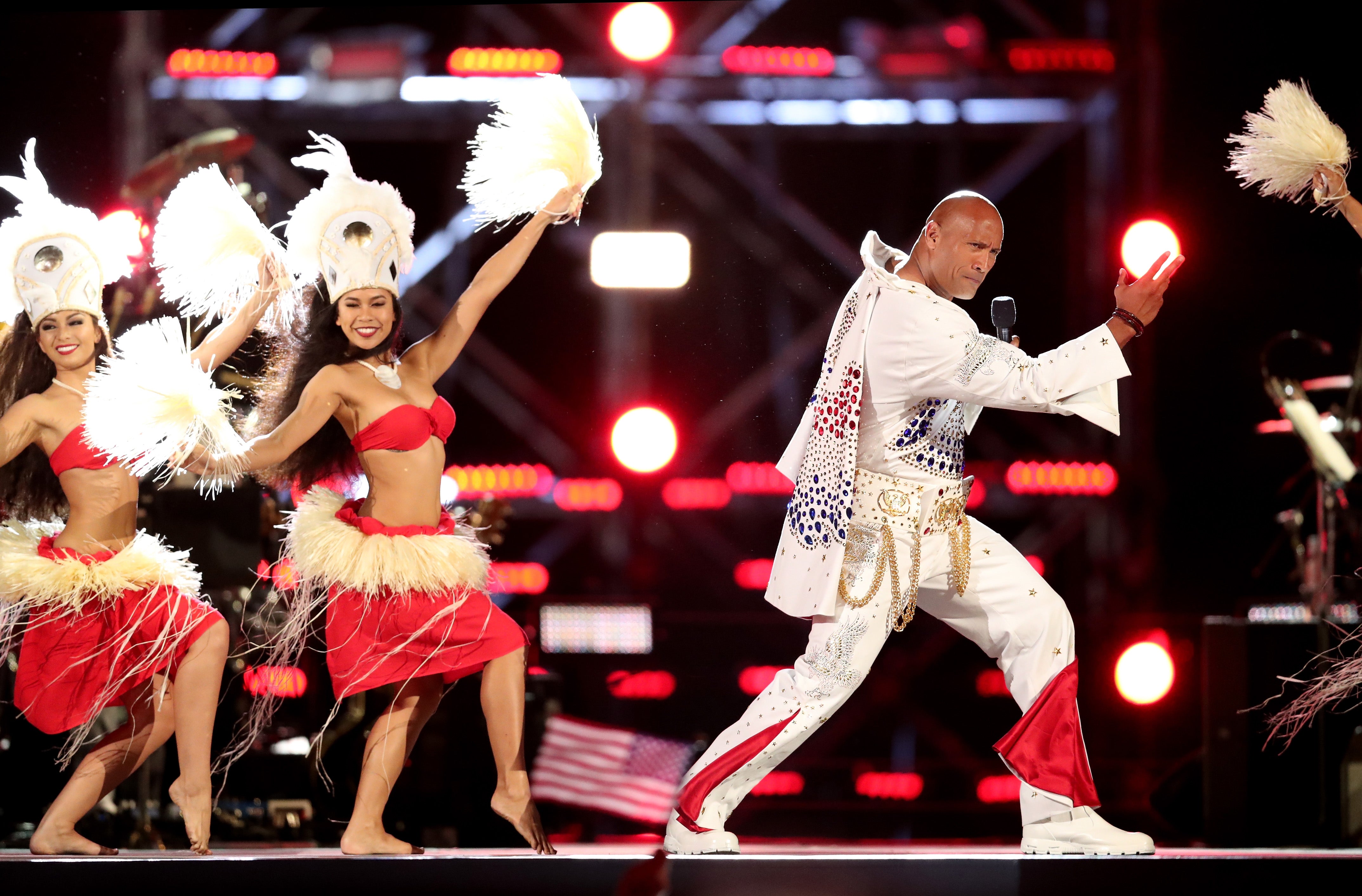<p>The Rock performs onstage during Spike's “Rock the Troops” event </p>