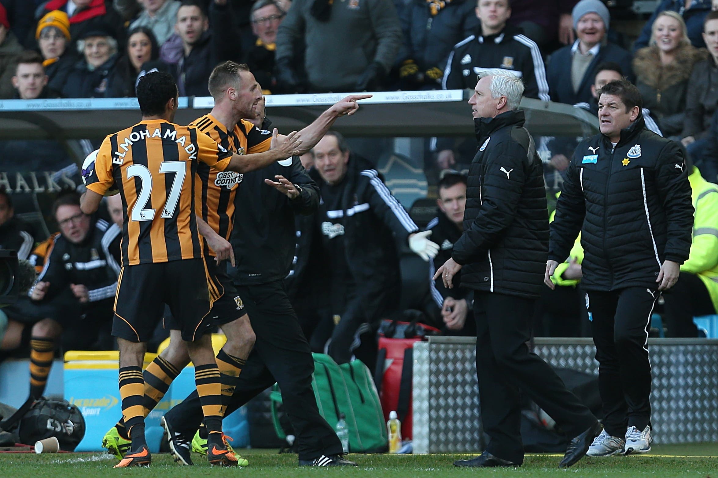Newcastle manager Alan Pardew, second right, confronts Hull midfielder David Meyler, left, in a 2014 incident that saw him suspended for seven games (Lynne Cameron/PA)