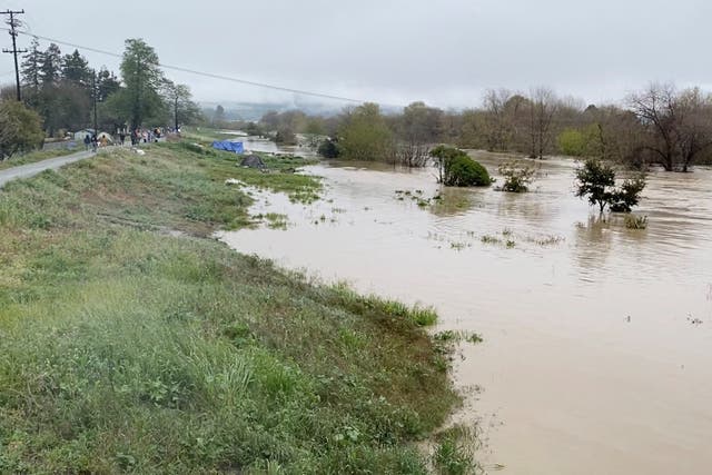 <p>A view shows the overflowing Pajaro River in Pajaro, California, U.S. March 11, 2023 in this screen grab obtained from a social media video. Twitter @BobbieGrennier/via REUTERS</p>