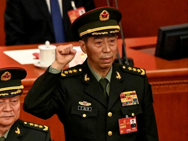 <p>Li Shangfu, China’s new defence minister, swears an oath after getting elected during the fourth plenary session of the National People’s Congress</p>